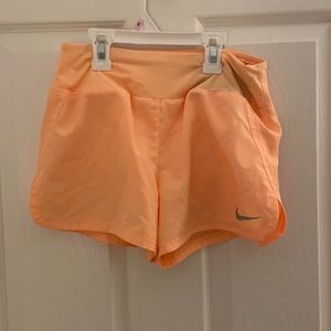 orange nike shorts